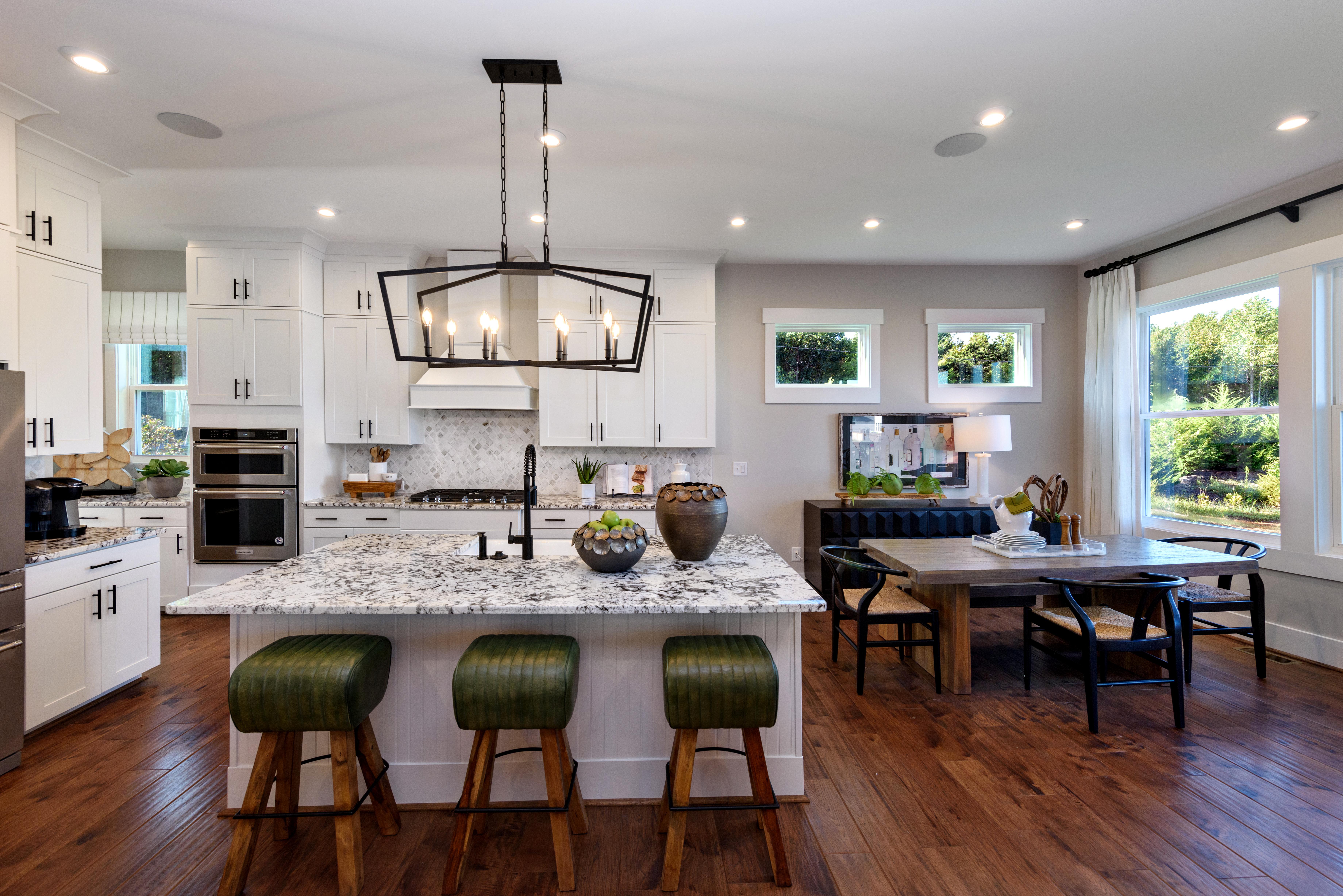 kitchen with white cabinets and large island