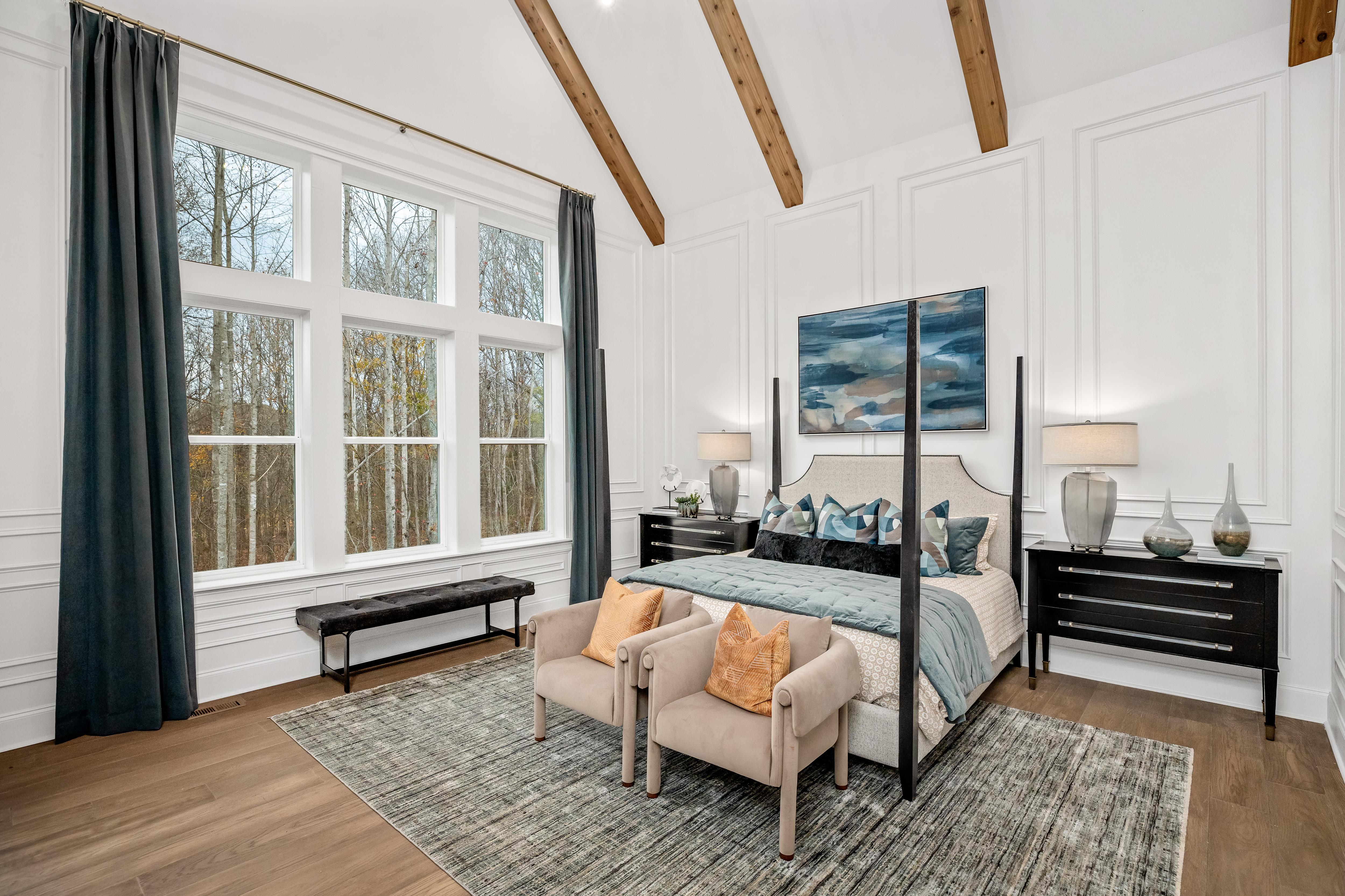 primary bedroom with vaulted ceiling