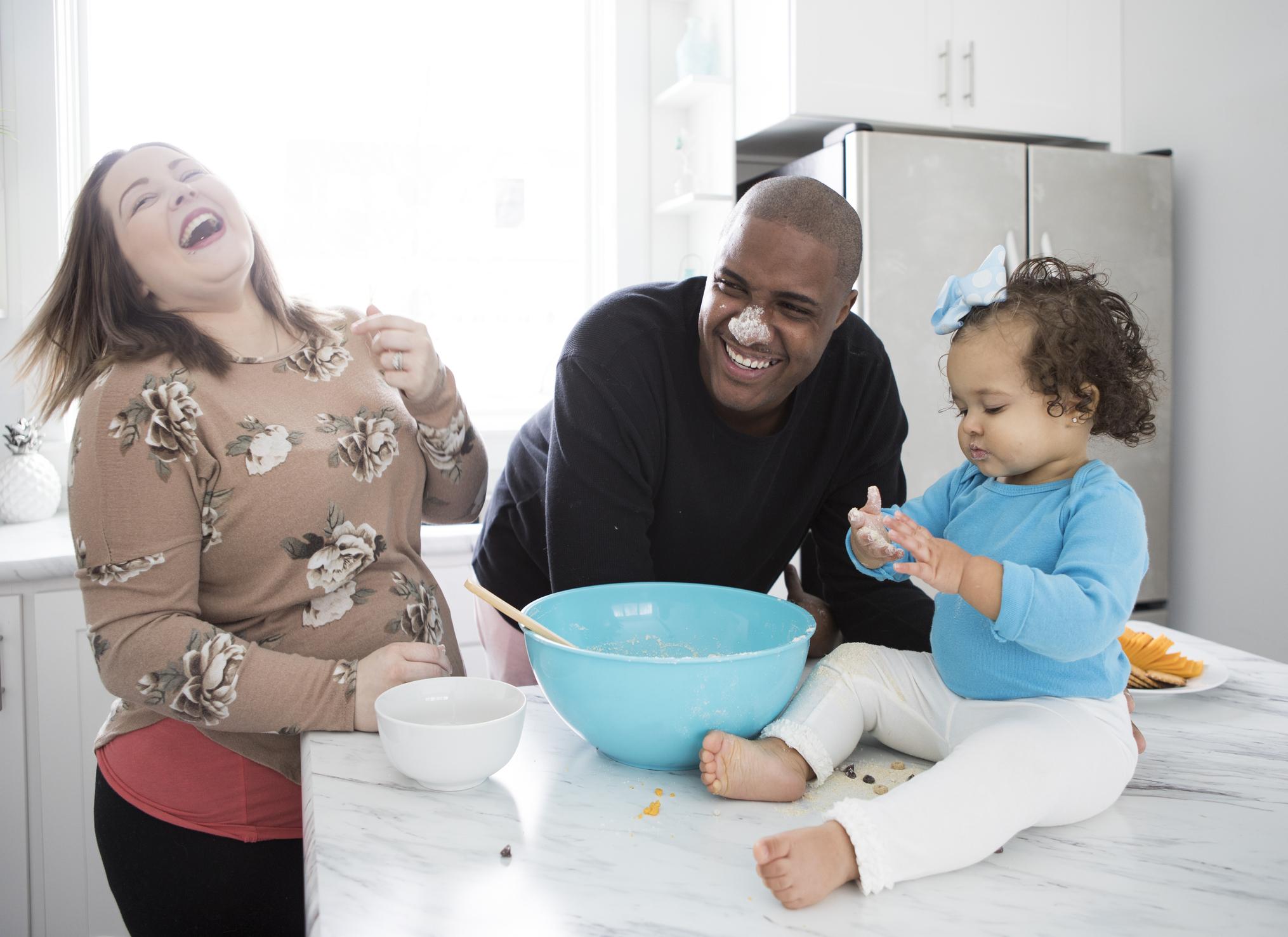 Family cooking in home kitchen