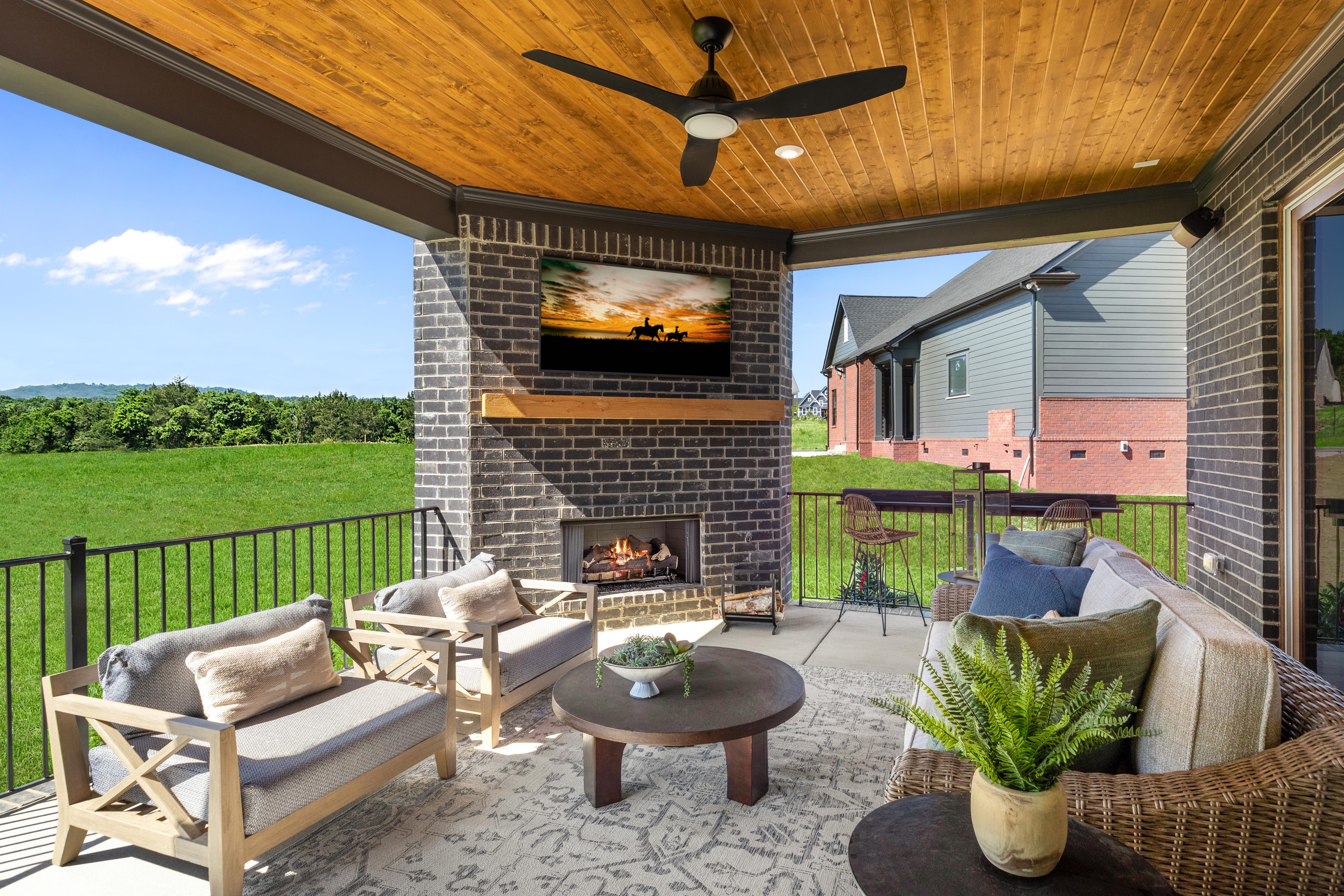 covered porch with fireplace