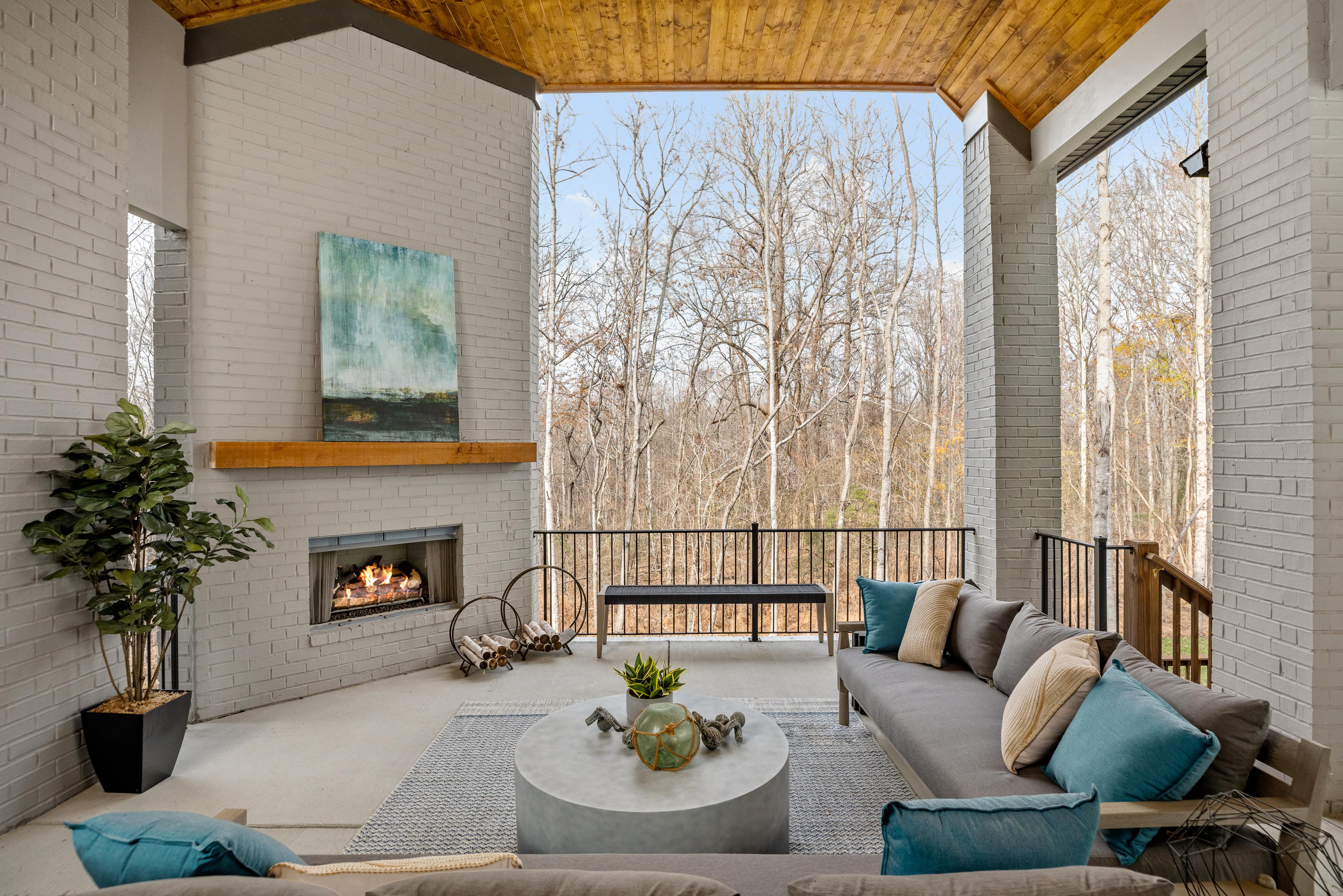 custom home covered patio with fireplace