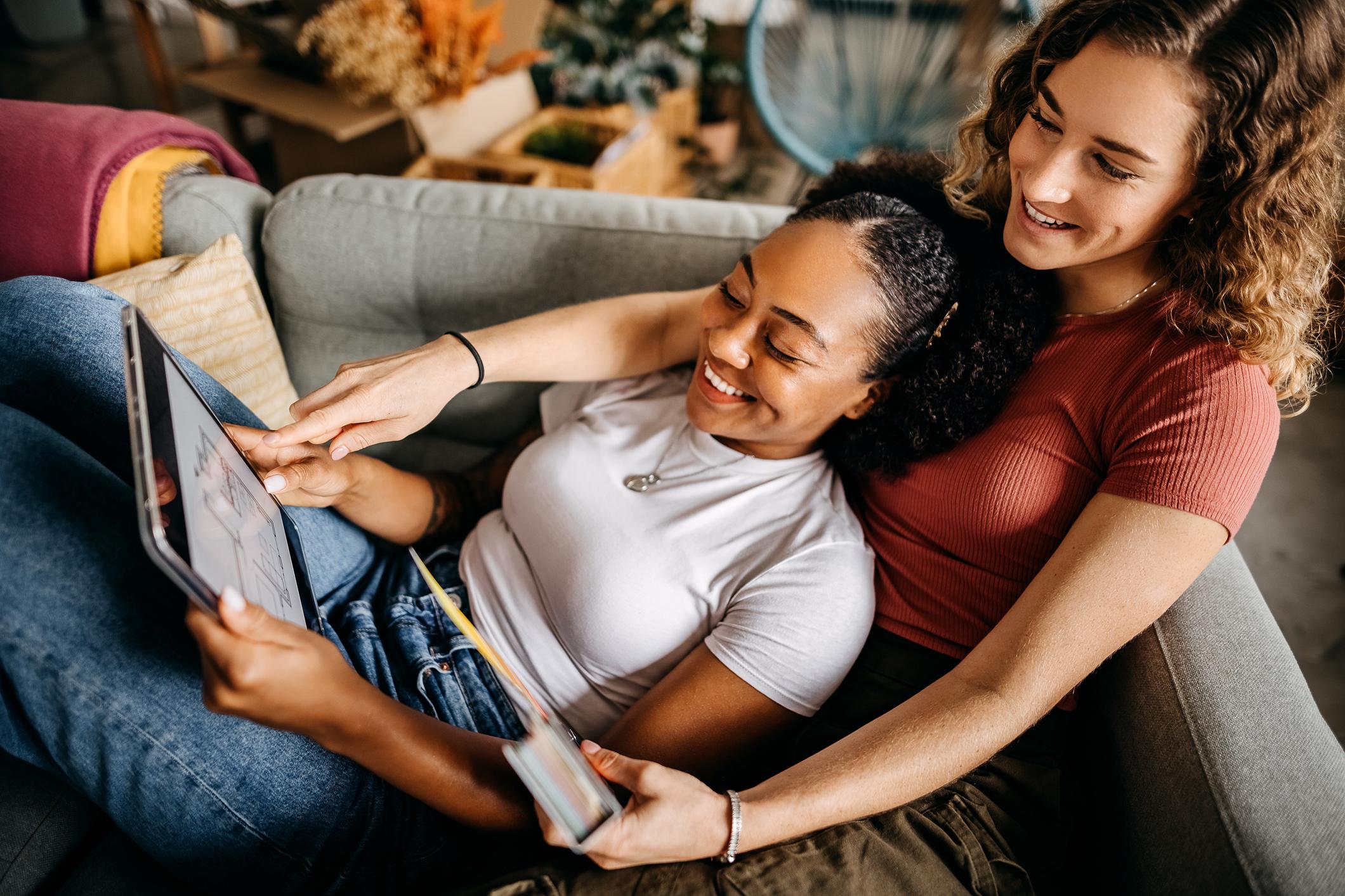 Women looking at home floorplans