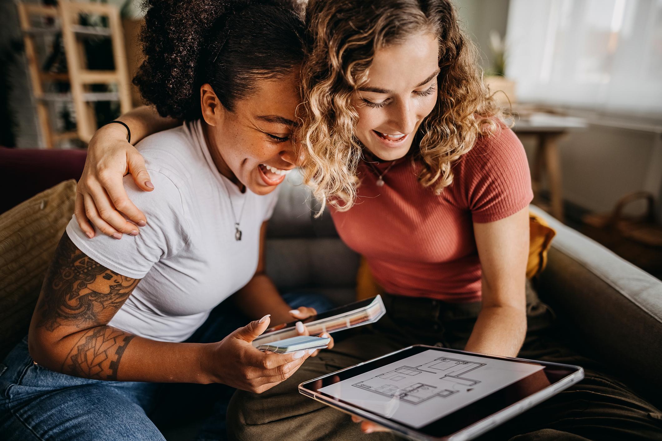 Women looking at home floorplans