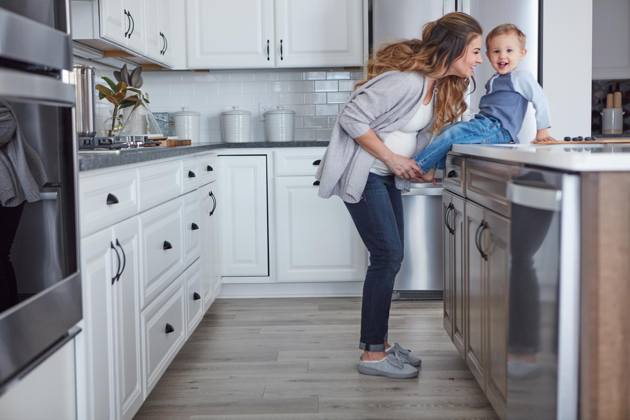 Mother and son playing in kitchen